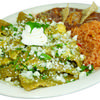 Our chilaquiles, available with either red or green salsa. Topped with onions, cilantro, queso fresco, and sour cream. Accompanied by rice, beans, and a side of bread.